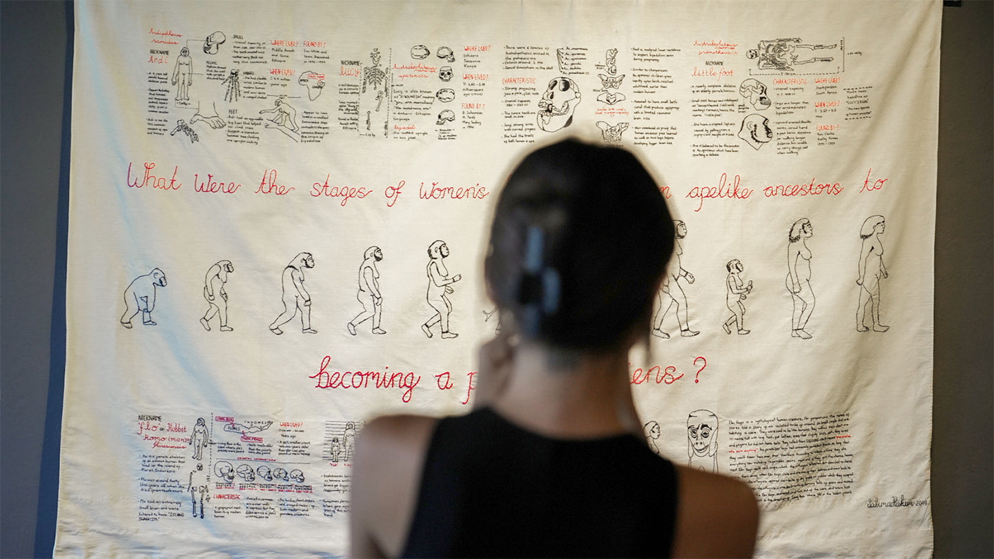Guest looking at one of the artwork of Salima Hakim at Penumbra Exhibition at BIASA Art, Ubud